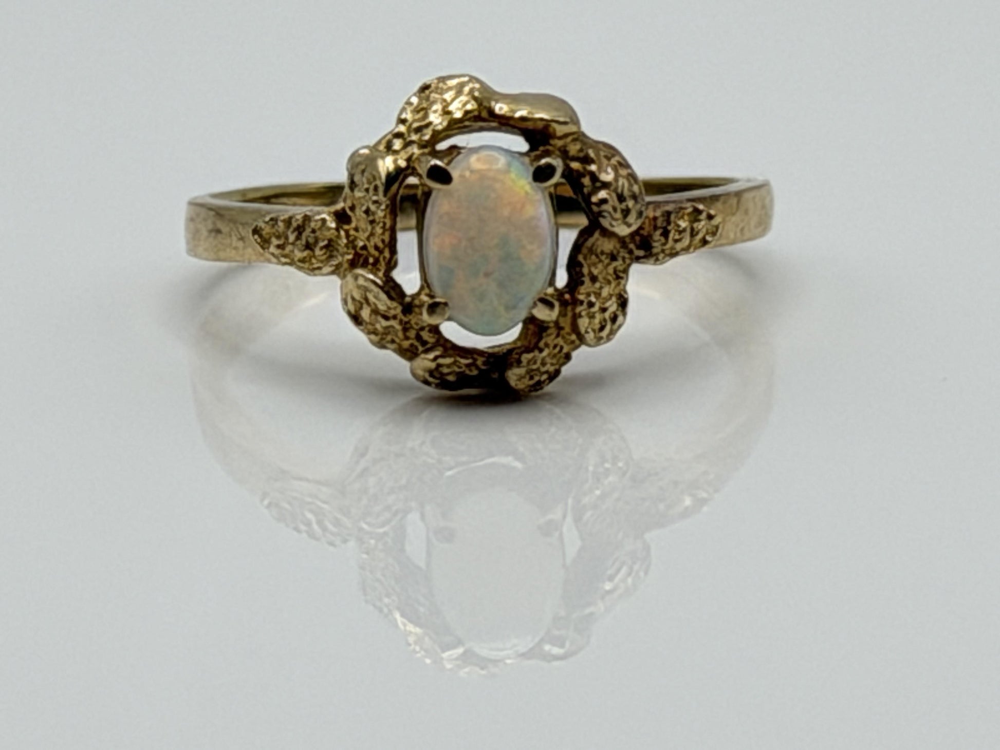10k Yellow Gold Natural Oval Opal Solitaire Delicate Leaf Textured Ring.