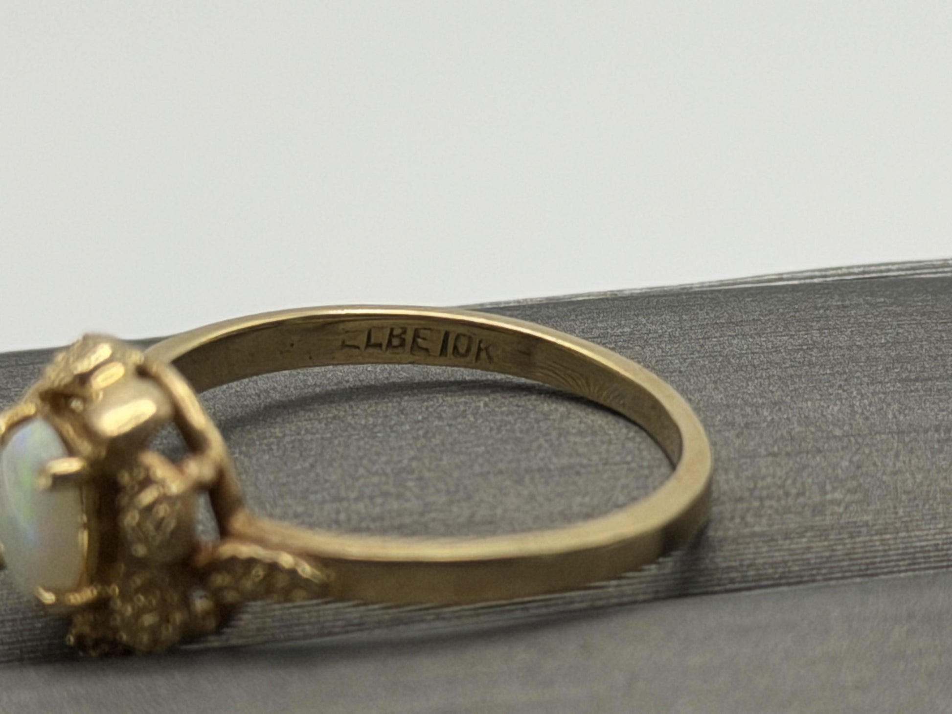 10k Yellow Gold Natural Oval Opal Solitaire Delicate Leaf Textured Ring.