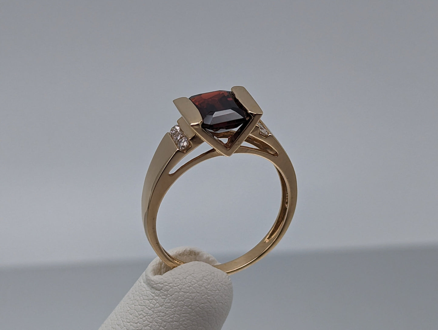 14k Yellow Gold Emerald Cut Garnet and Diamonds Chanel Setting Ring. 14k Garnet and Diamonds Cocktail Ring.