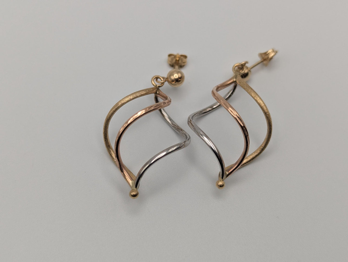 14k Multi-Gold Twisted Infinity Dangle Earrings. Twisted Classic Dangle Hoops.