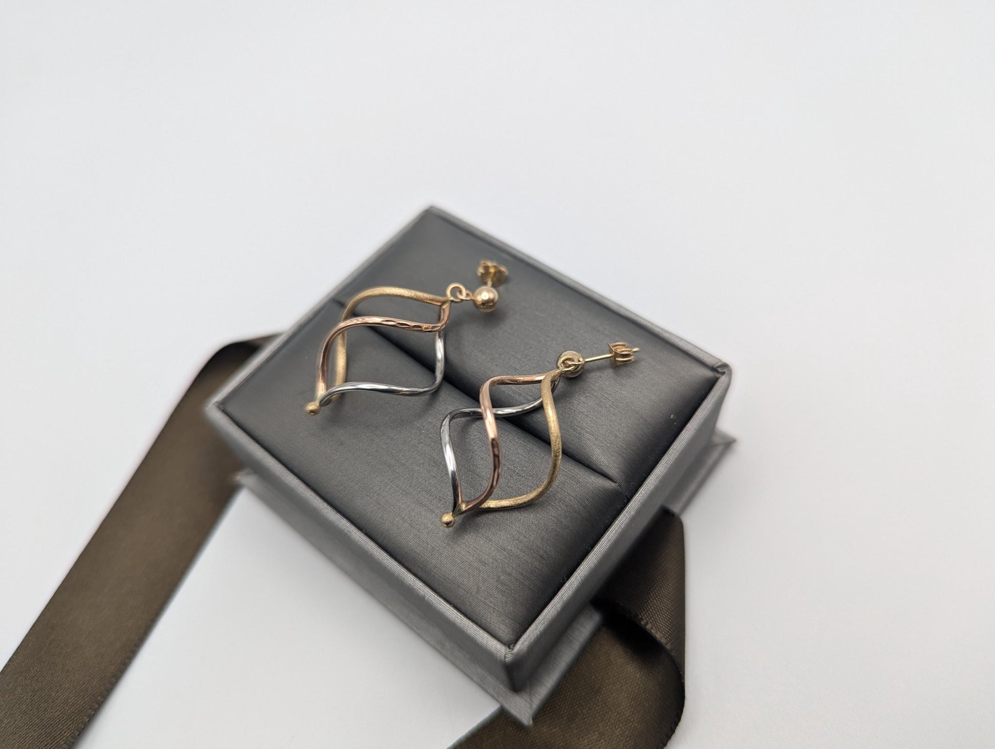 14k Multi-Gold Twisted Infinity Dangle Earrings. Twisted Classic Dangle Hoops.