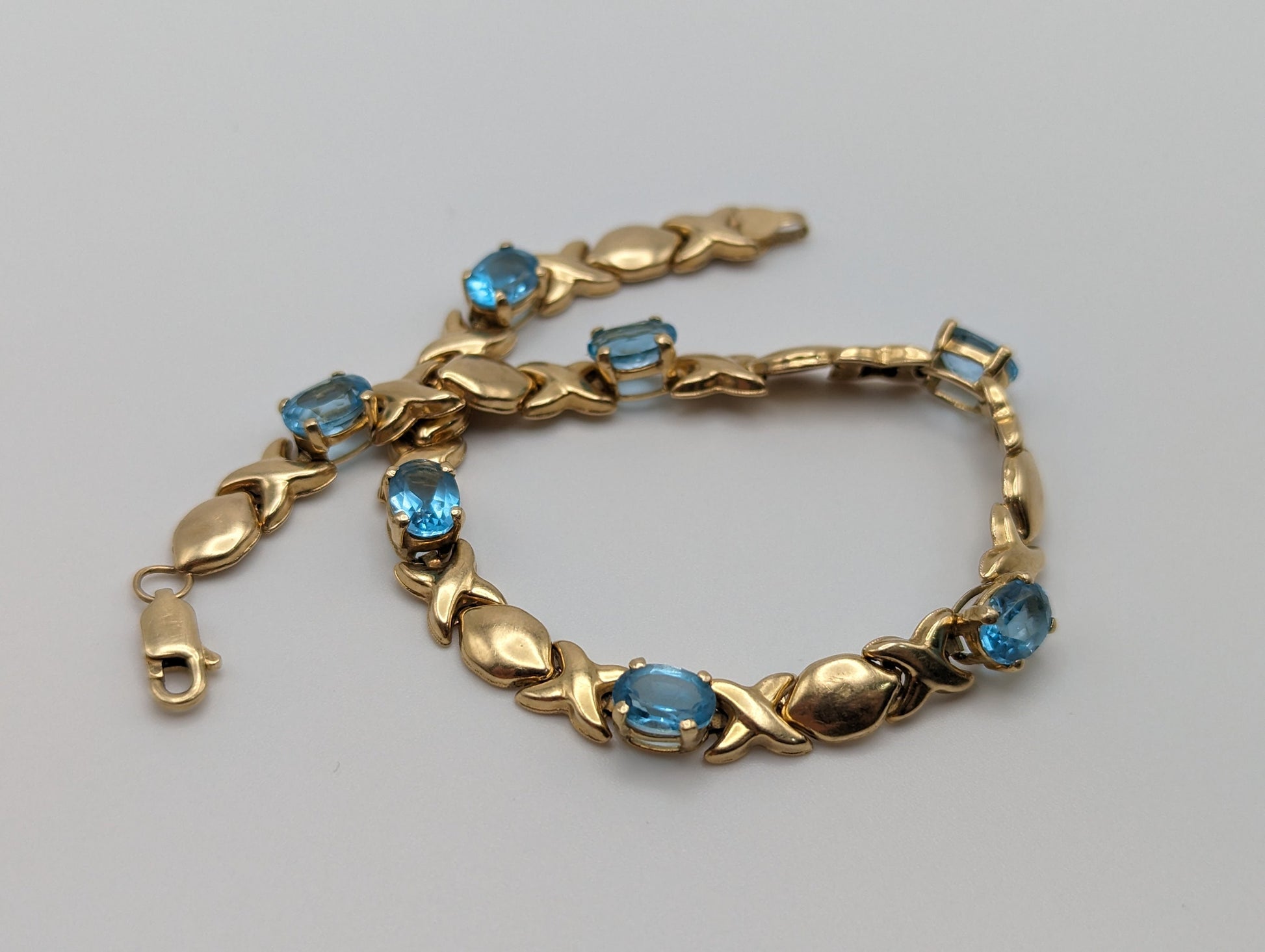 14k Solid Yellow Gold Swiss BlueTopaz Bracelet. XO Hugs & Kisses 14k Yellow Gold Bracelet 8". Womens 14k Swiss Blue Topaz XO bracelet.