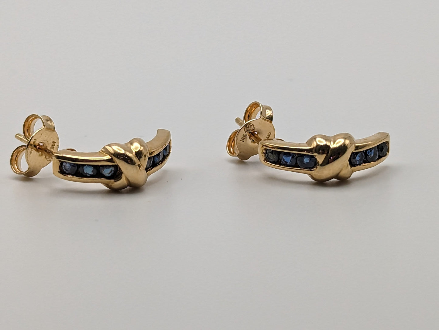 14k Yellow Gold Blue Sapphire Huggie Earrings. 14k Yellow Plug Earrings. 14k Omega Back Sapphire Earrings.