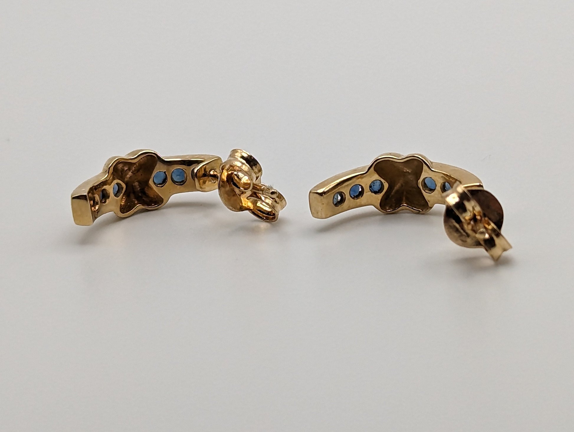 14k Yellow Gold Blue Sapphire Huggie Earrings. 14k Yellow Plug Earrings. 14k Omega Back Sapphire Earrings.