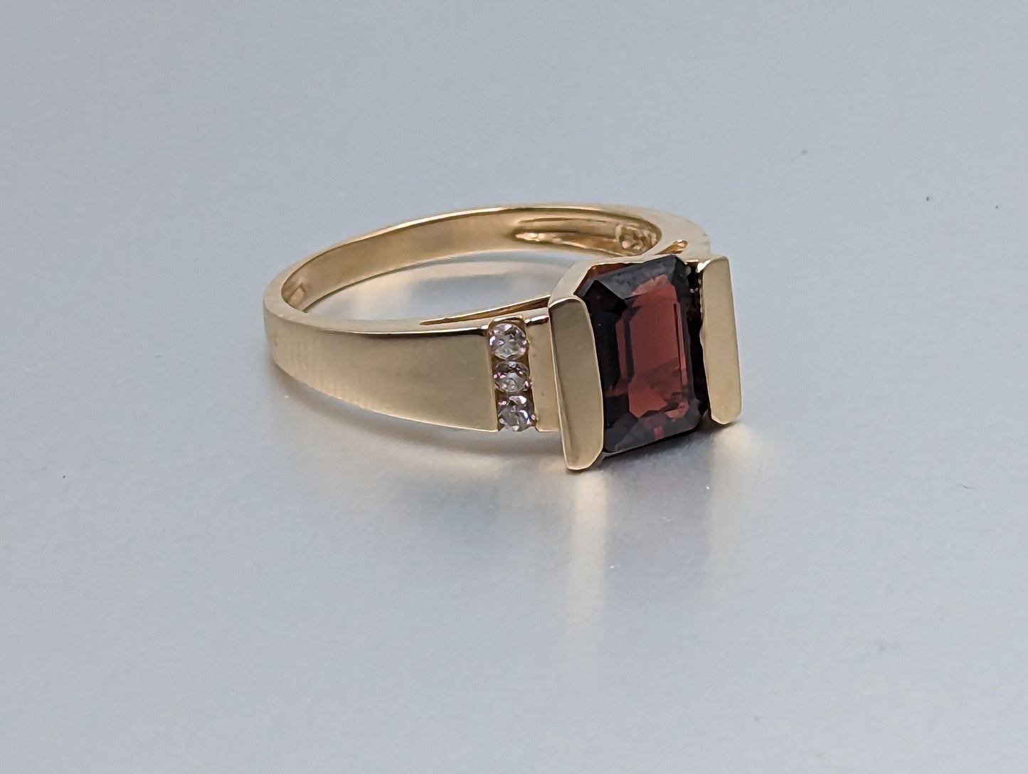 14k Yellow Gold Emerald Cut Garnet and Diamonds Chanel Setting Ring. 14k Garnet and Diamonds Cocktail Ring.