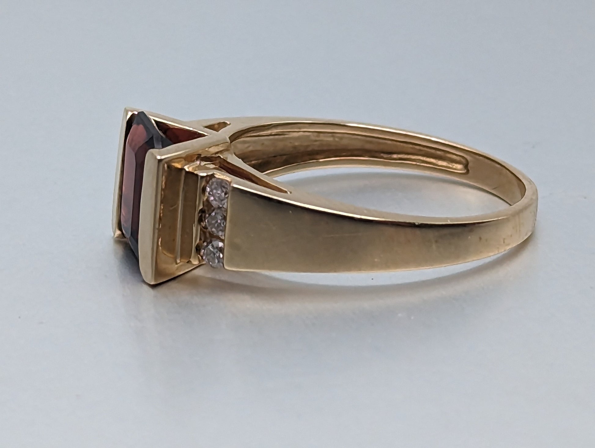 14k Yellow Gold Emerald Cut Garnet and Diamonds Chanel Setting Ring. 14k Garnet and Diamonds Cocktail Ring.