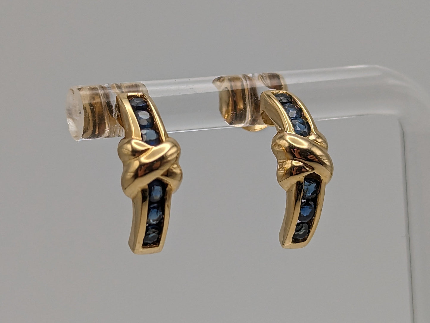 14k Yellow Gold Blue Sapphire Huggie Earrings. 14k Yellow Plug Earrings. 14k Omega Back Sapphire Earrings.