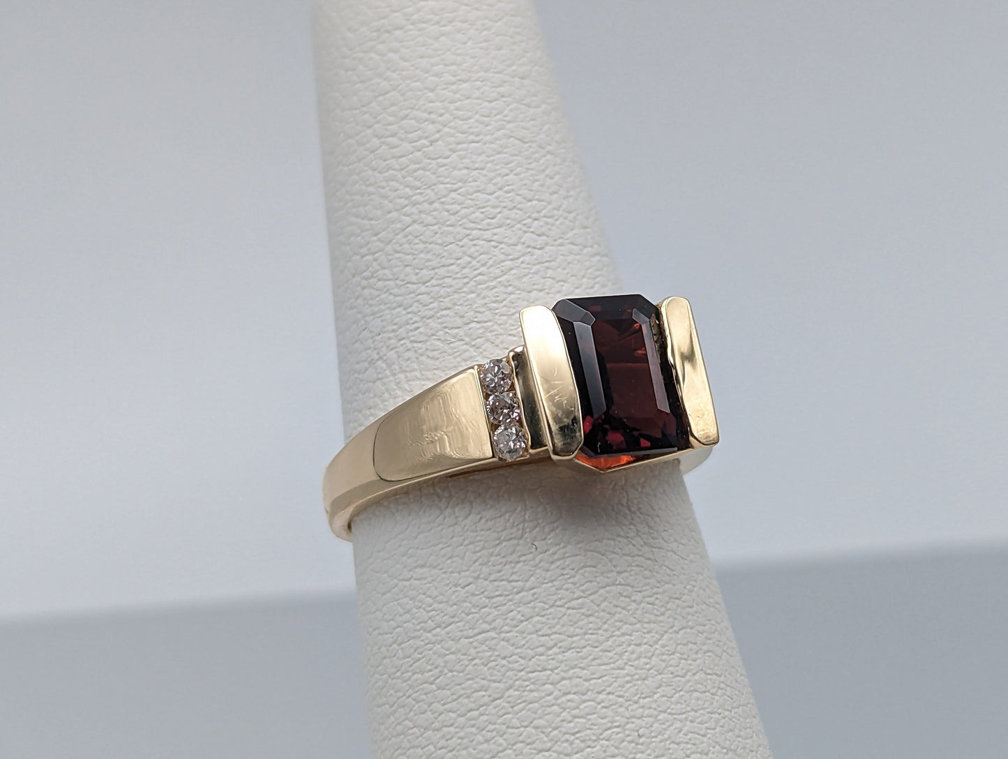 14k Yellow Gold Emerald Cut Garnet and Diamonds Chanel Setting Ring. 14k Garnet and Diamonds Cocktail Ring.