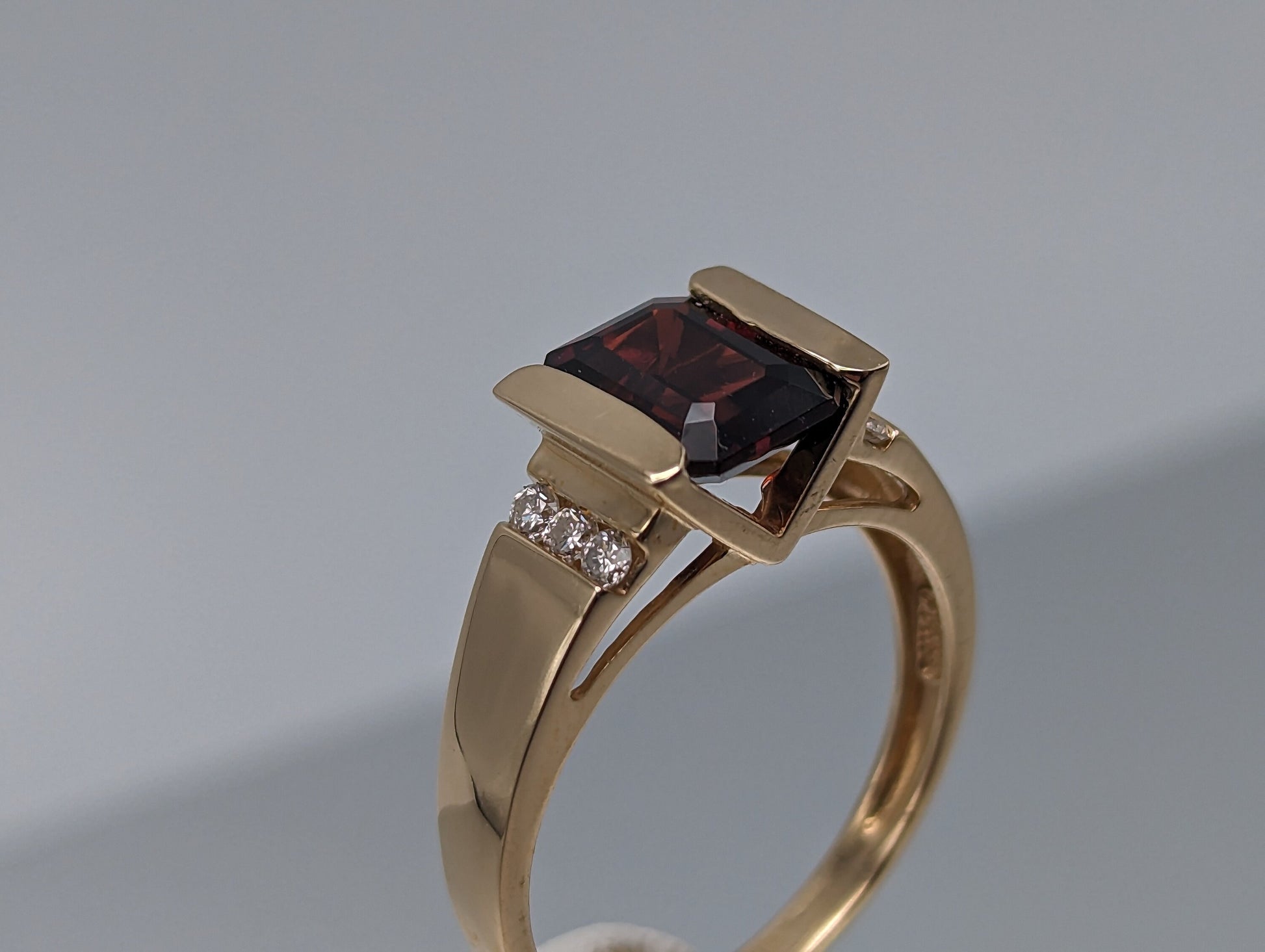 14k Yellow Gold Emerald Cut Garnet and Diamonds Chanel Setting Ring. 14k Garnet and Diamonds Cocktail Ring.