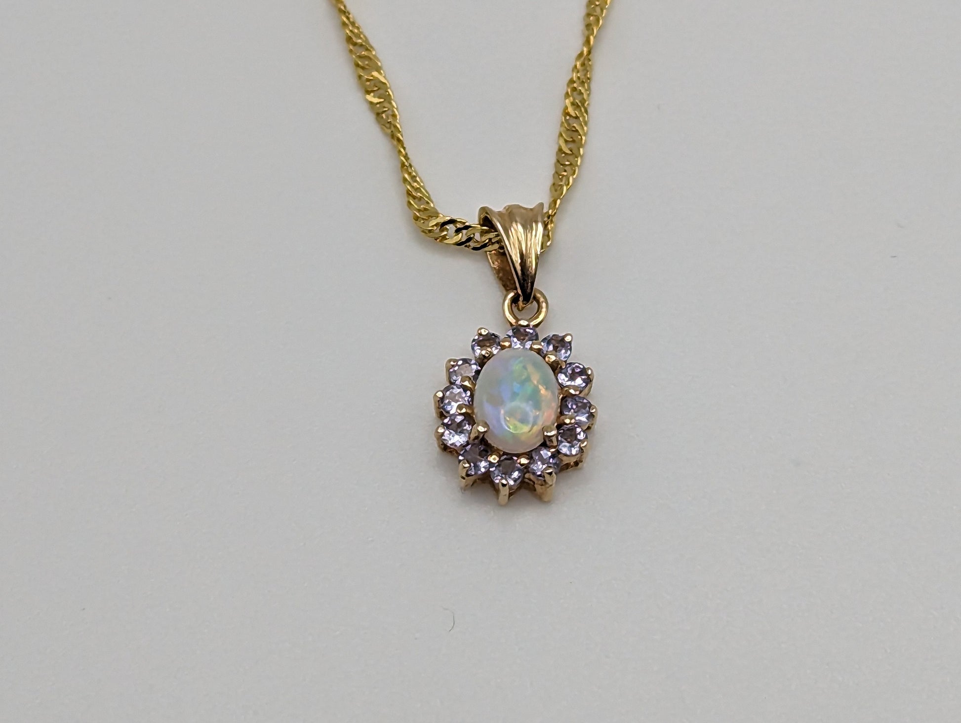 10k Yellow Gold Opal and Tanzanite Pendant. 10k Oval Opal Pendant. Complimentary 18k GF necklace