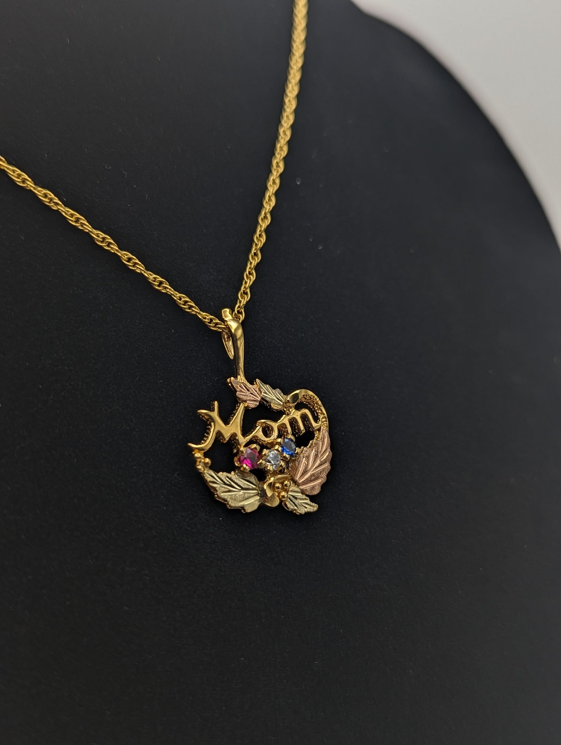 14k Black Hills Gold MOM Necklace. Black Hills Gold Mom w/ Ruby and Topaz Necklace. 18" GF Chain,