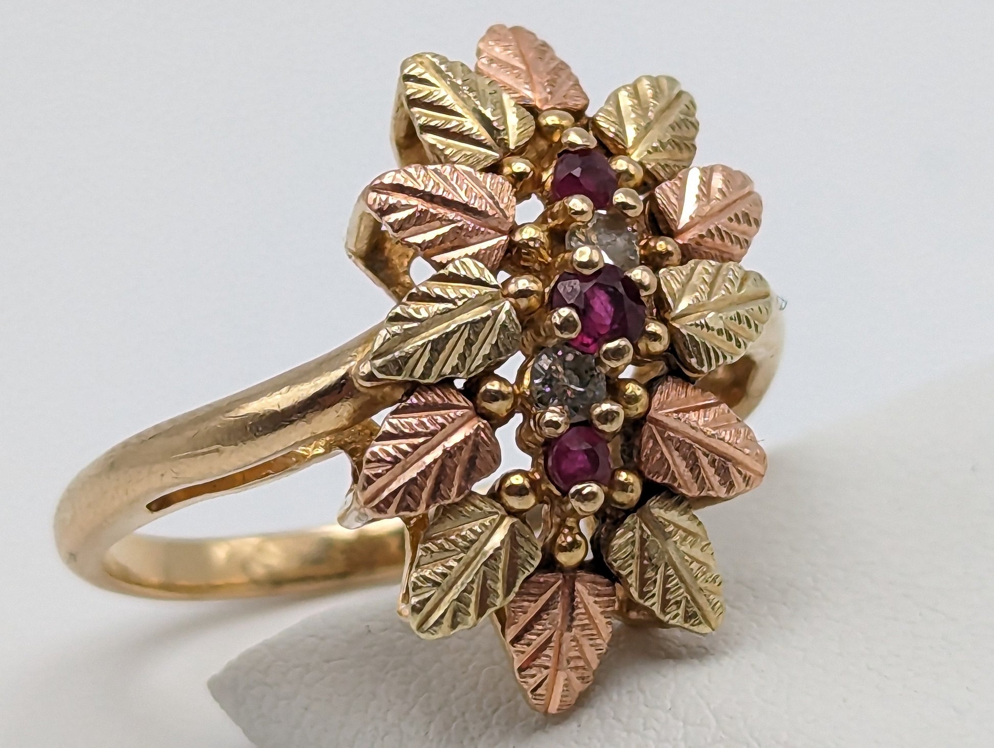 10k Heavy Black Hills Gold Tri-Colored Leaf Ruby Diamond Leaf Ring. Womens Black Hills Trio Gold Diamond and Ruby Leaf Ring.